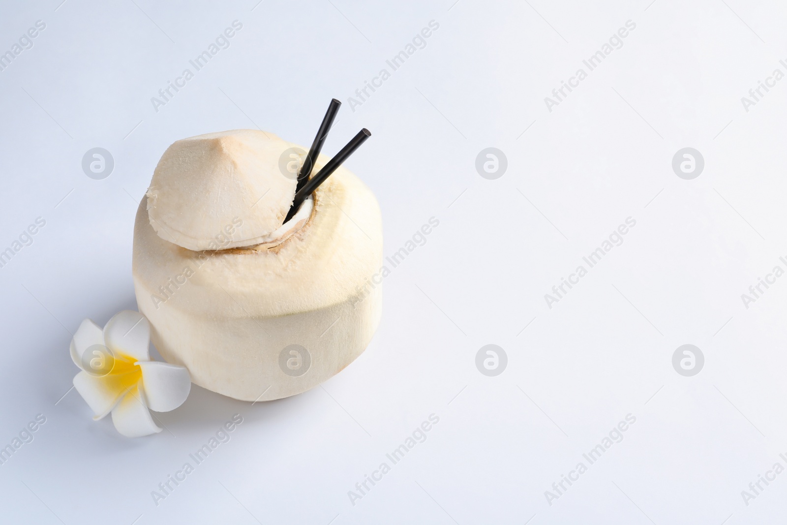 Photo of Fresh coconut drink in nut on white background