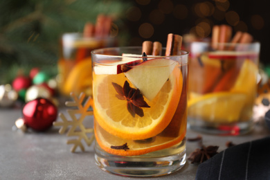 Aromatic white mulled wine on light grey table