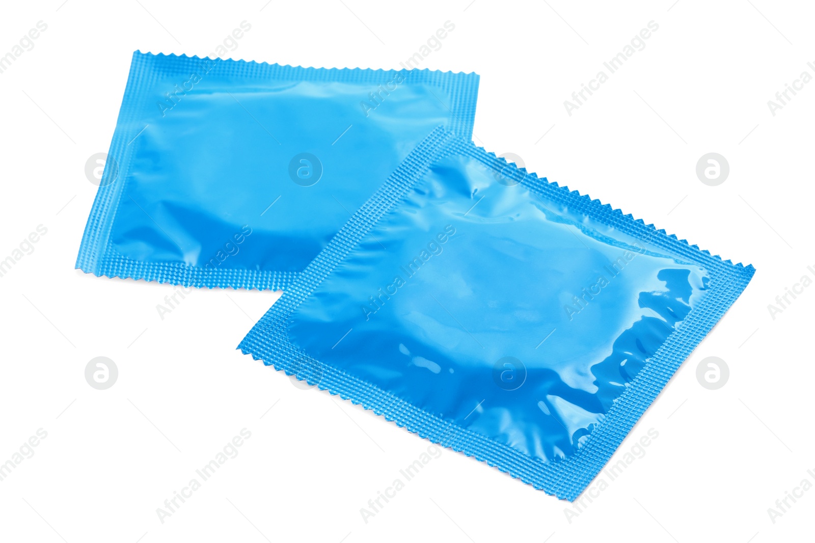 Photo of Condom packages isolated on white. Safe sex