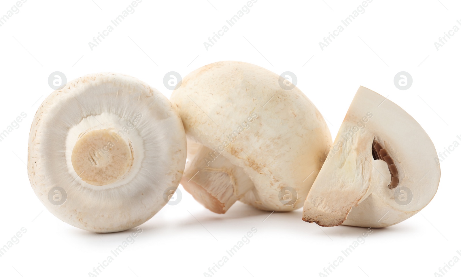 Photo of Fresh raw champignon mushrooms on white background