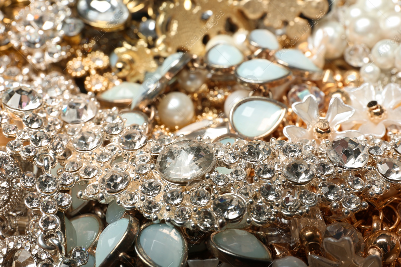 Photo of Different stylish jewelry as background, closeup view