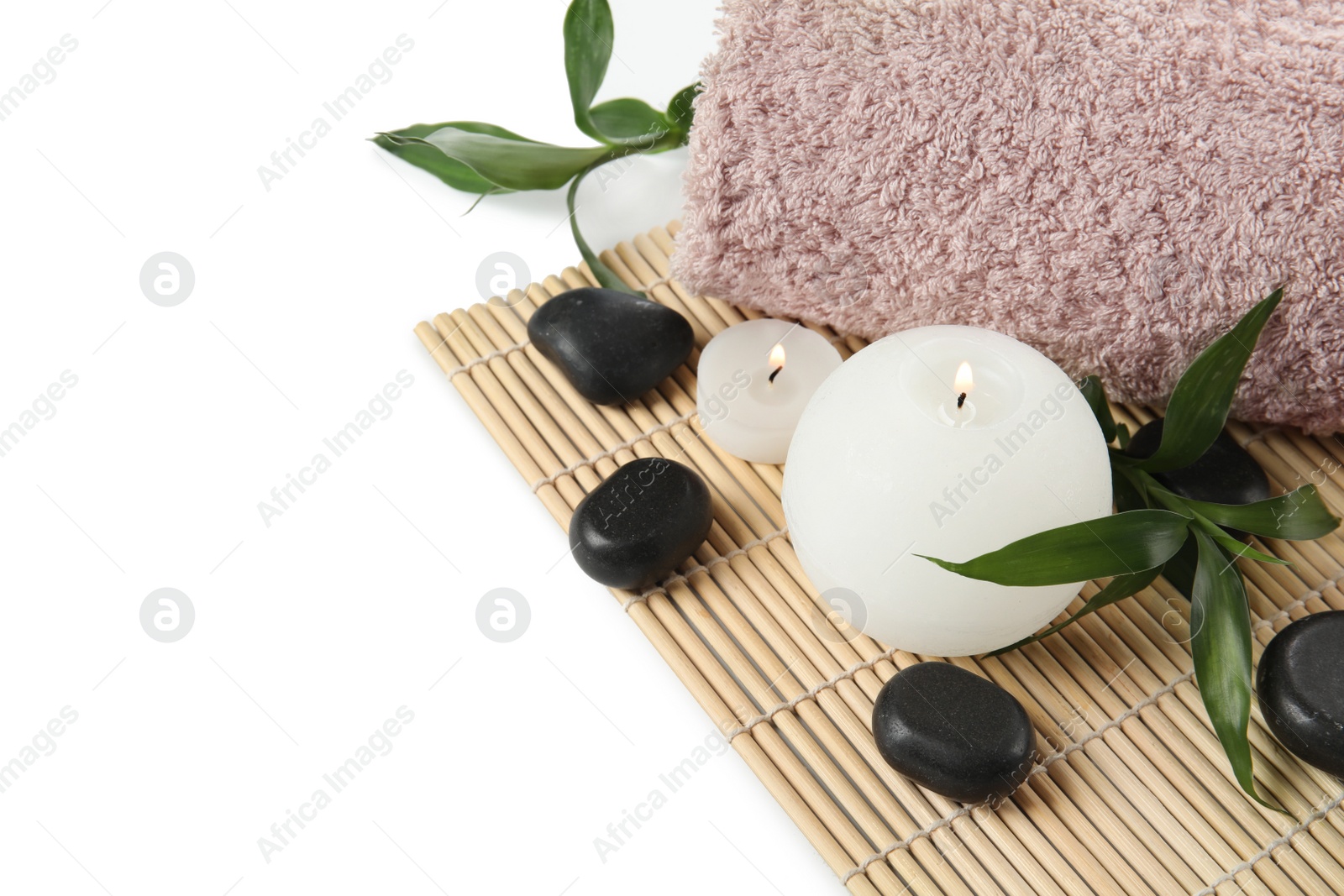 Photo of Beautiful spa composition with candles and towel on white background