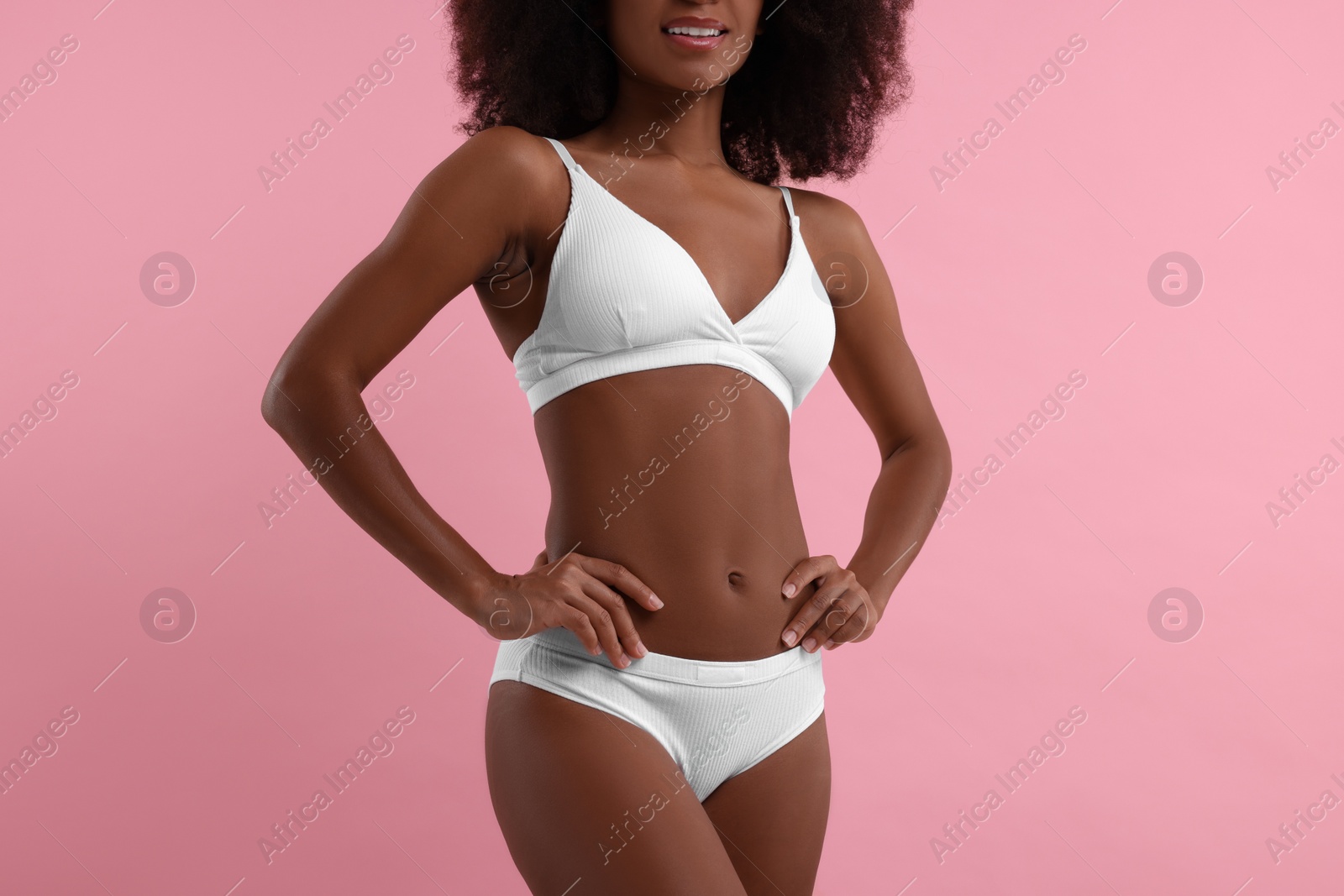 Photo of Woman in stylish bikini on pink background, closeup