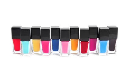 Bottles of nail polish on white background