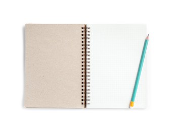 Photo of Notebook and pencil isolated on white, top view