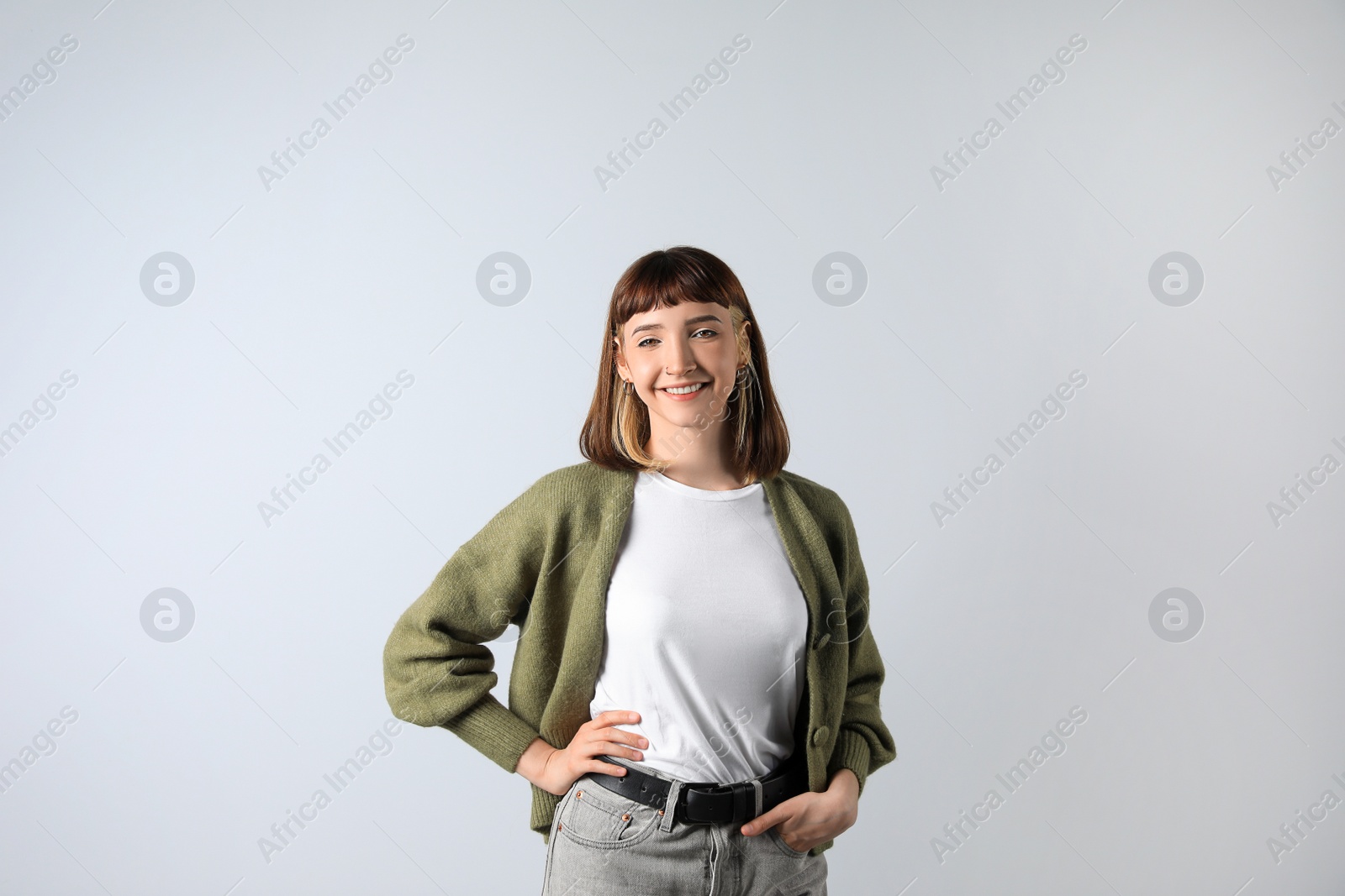 Photo of Beautiful young girl smiling on white background