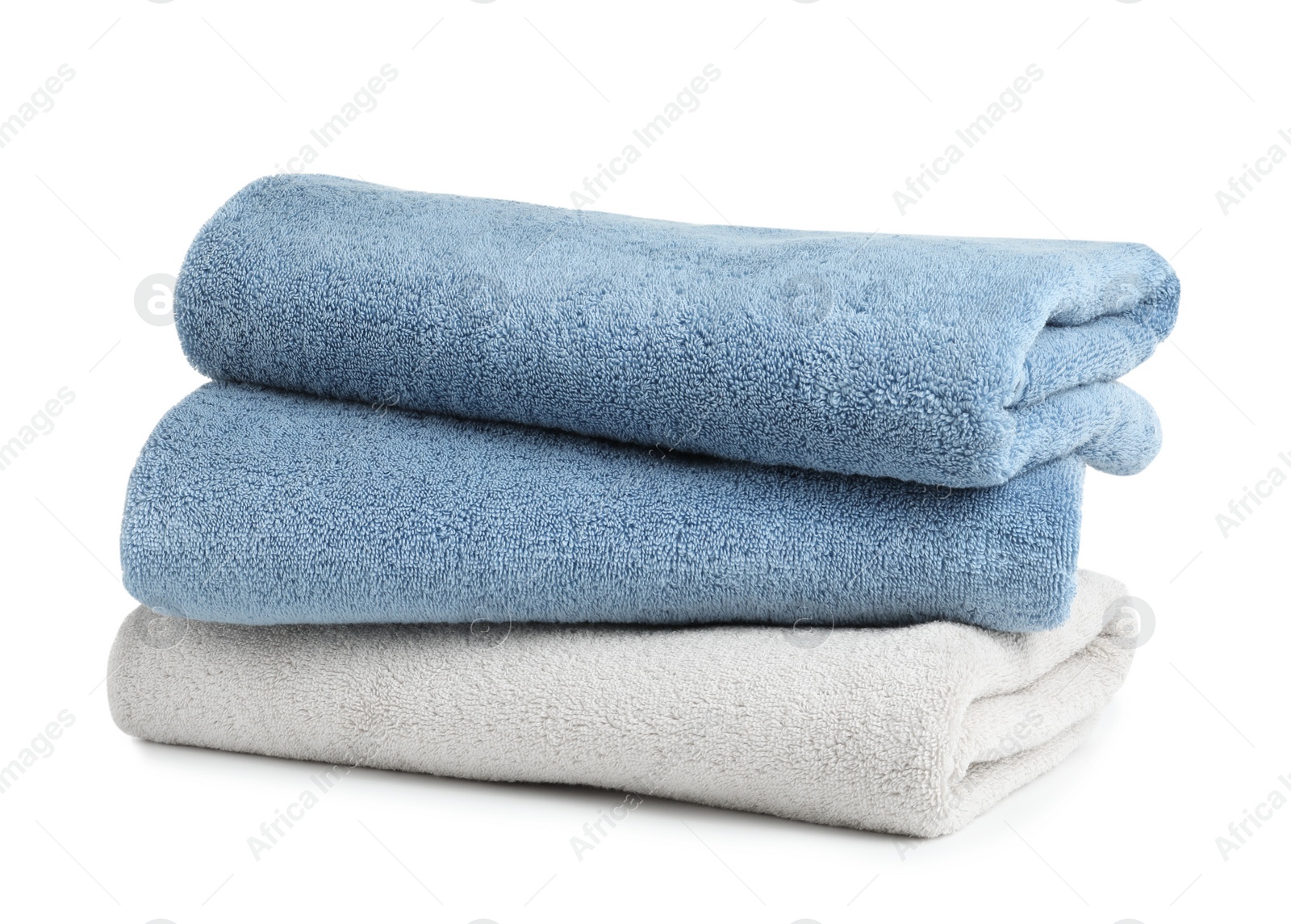 Photo of Stack of clean soft towels on white background