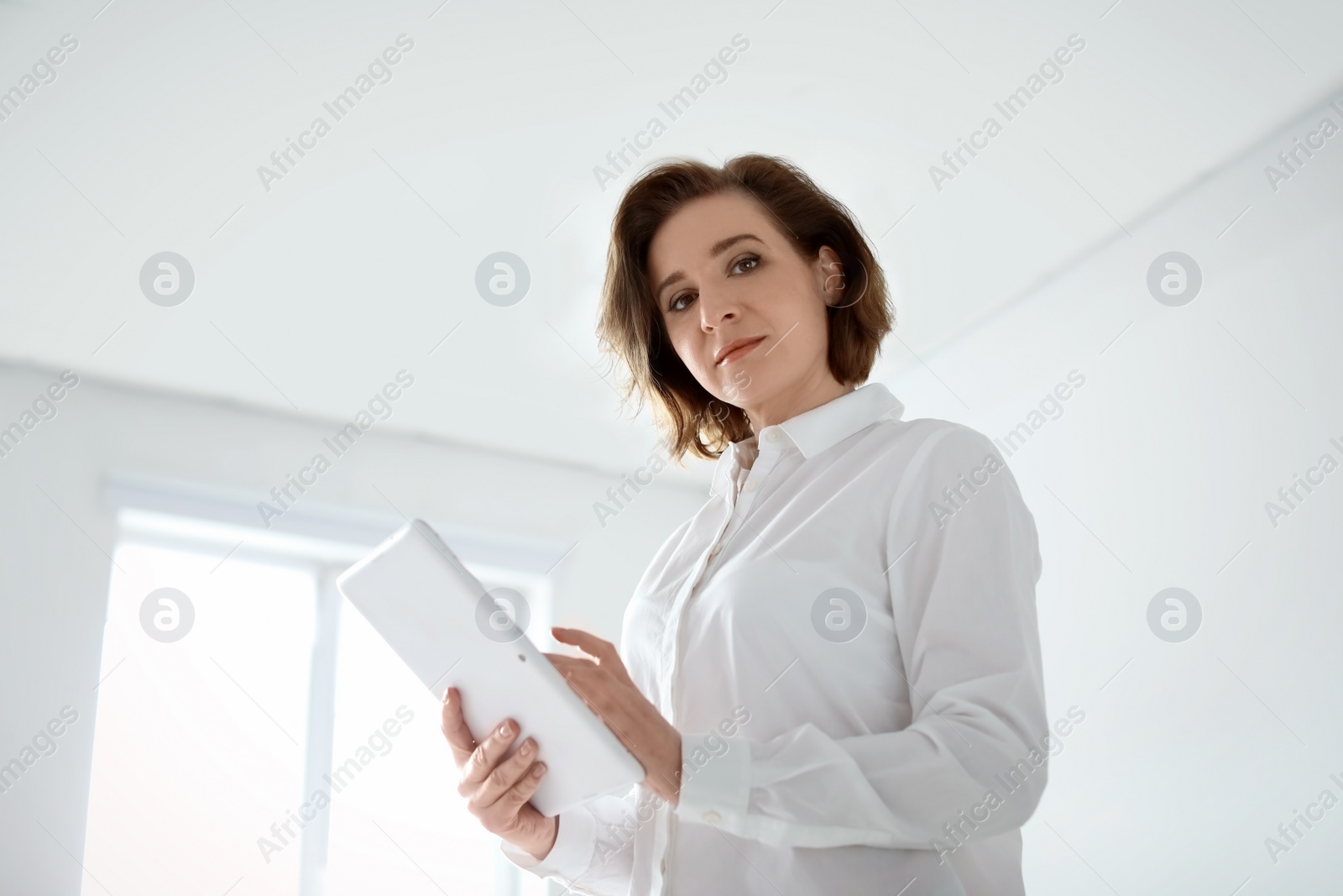 Photo of Female lawyer working with tablet in office