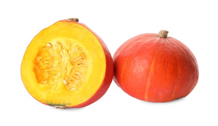 Photo of Whole and cut ripe pumpkins on white background