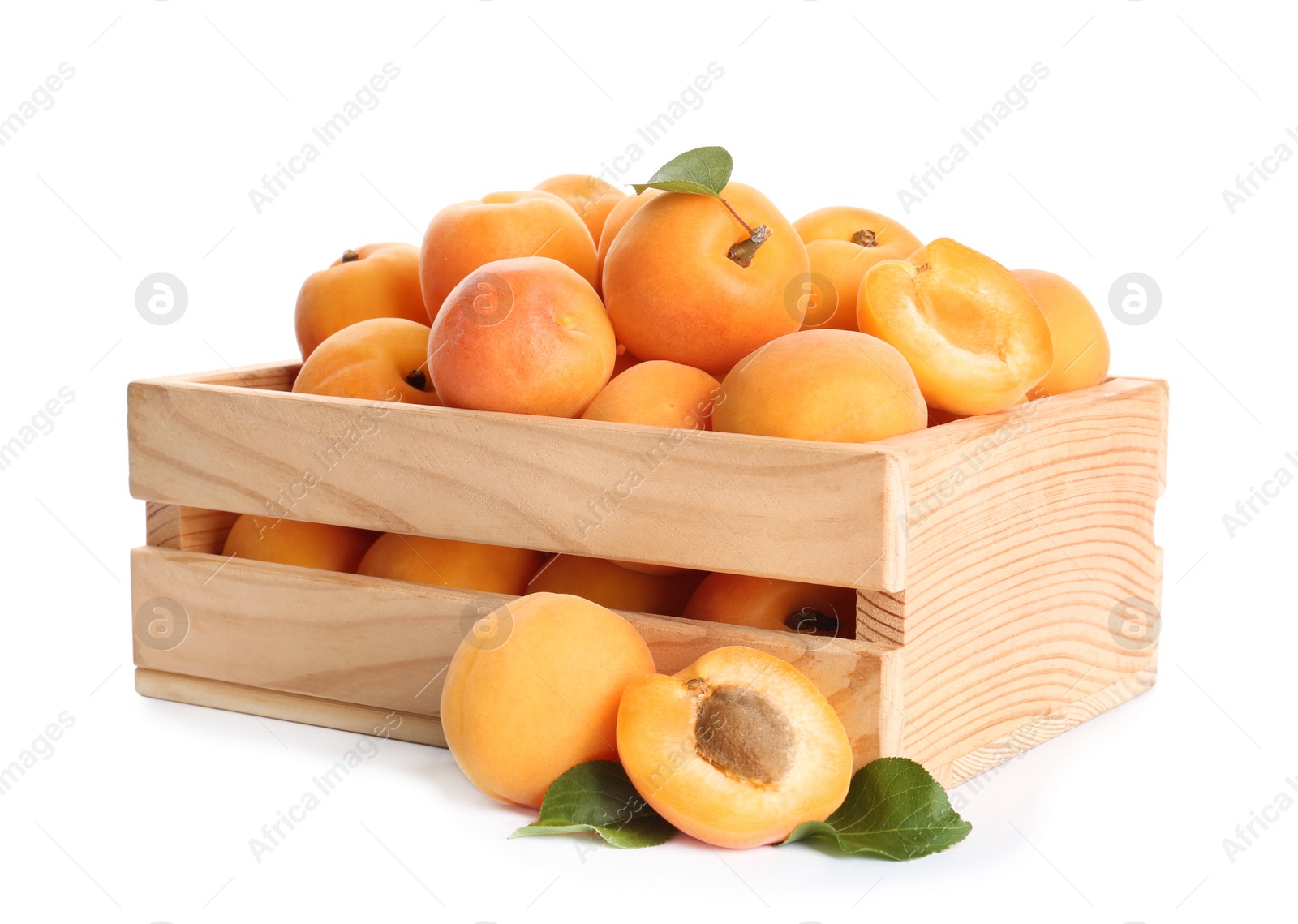 Photo of Wooden crate of delicious ripe sweet apricots isolated on white