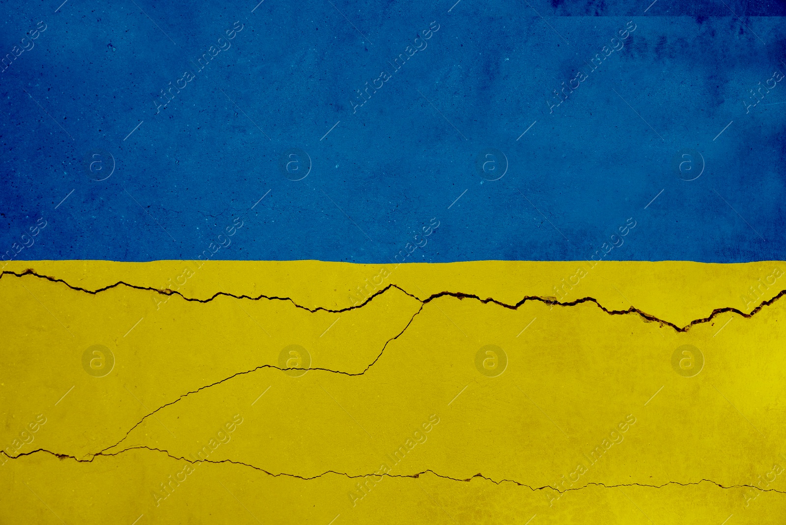 Image of National flag of Ukraine painted on old cracked wall