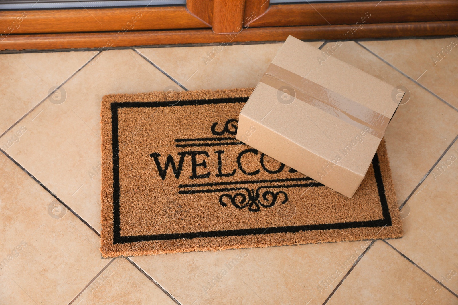 Photo of Parcel delivered on mat near front door