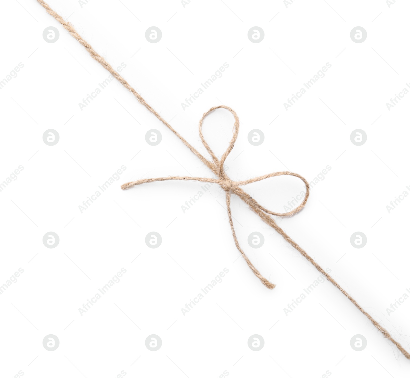 Photo of Linen rope string with bow isolated on white, top view