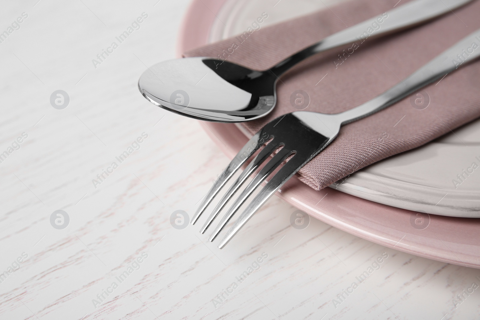 Photo of Beautiful table setting on white wooden background, closeup