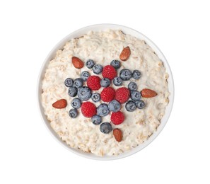 Tasty boiled oatmeal with berries and almonds in bowl isolated on white, top view