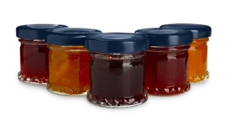 Photo of Jars with different jams on white background