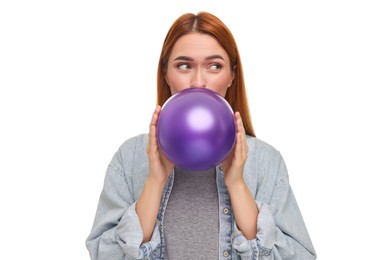 Woman inflating purple balloon on white background