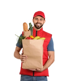 Photo of Man holding paper bag with fresh products on white background. Food delivery service