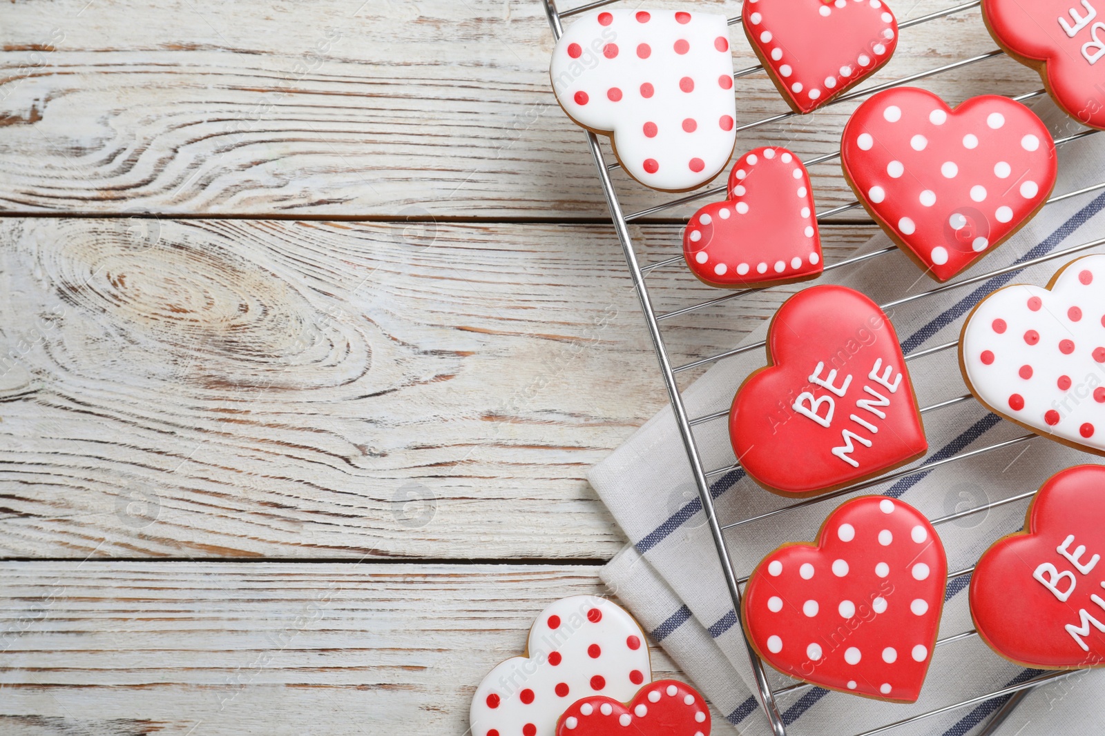 Photo of Heart shaped cookies on white wooden table, flat lay with space for text. Valentine's day treat