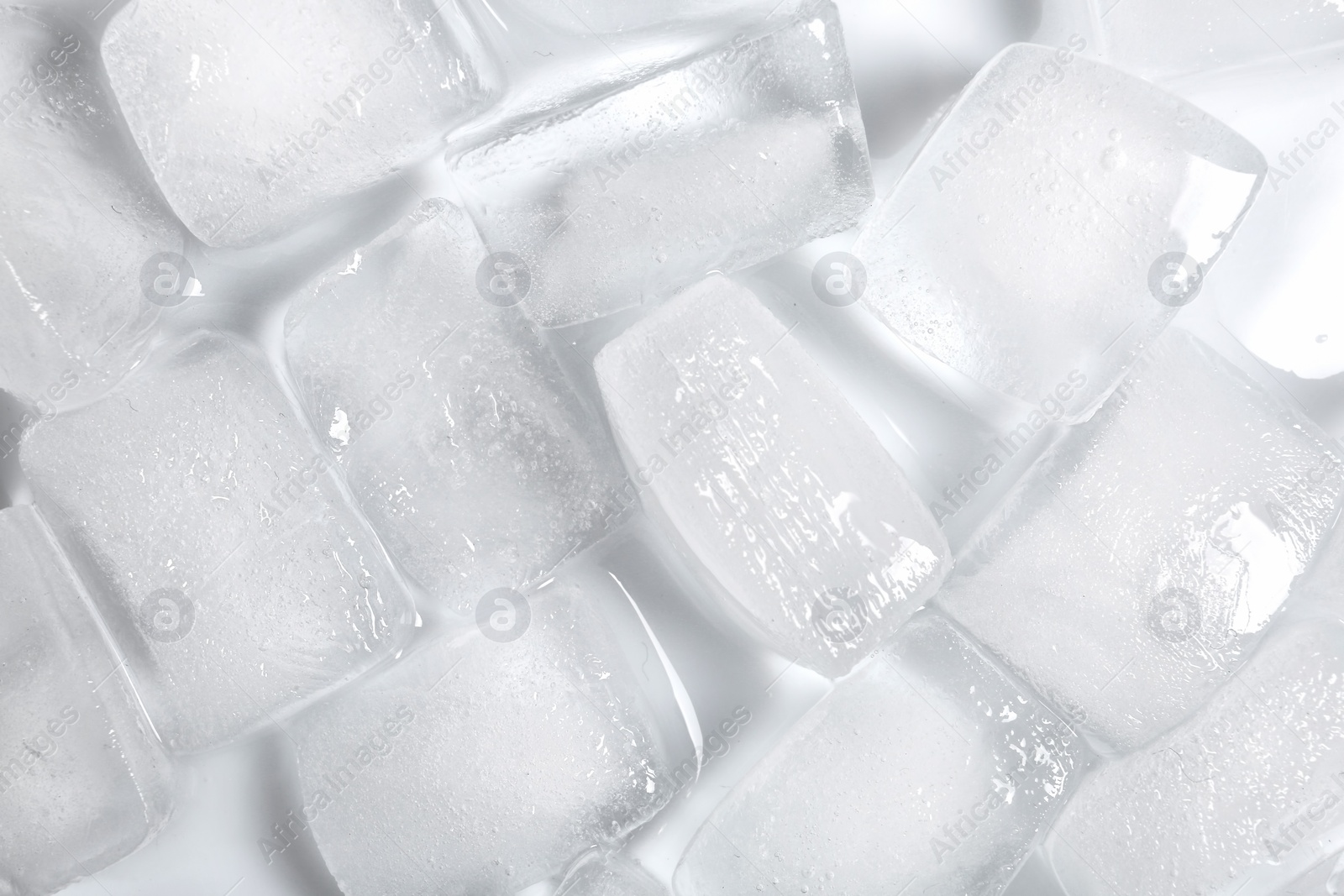 Photo of Ice cubes on white background, top view