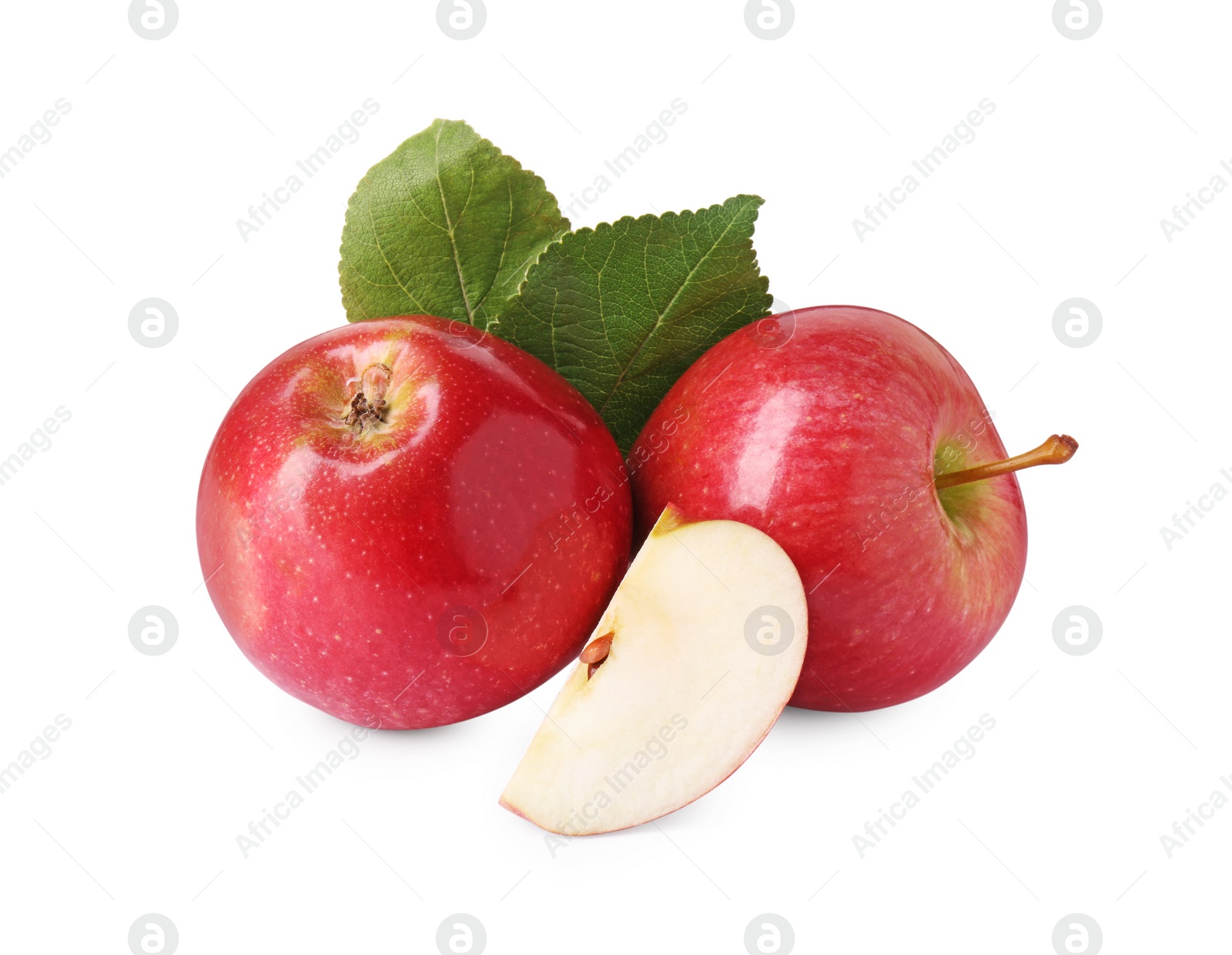 Photo of Whole, cut red apples and leaves isolated on white