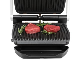 Electric grill with raw meat steaks and rosemary isolated on white