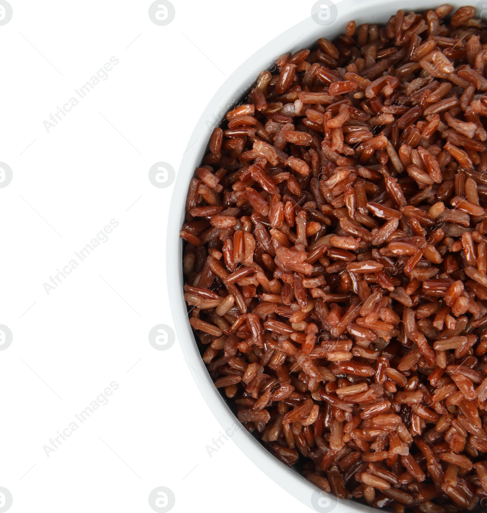 Photo of Bowl with delicious cooked brown rice on white background, top view