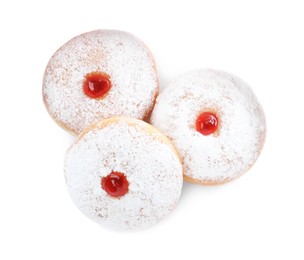 Delicious donuts with jelly and powdered sugar on white background, top view