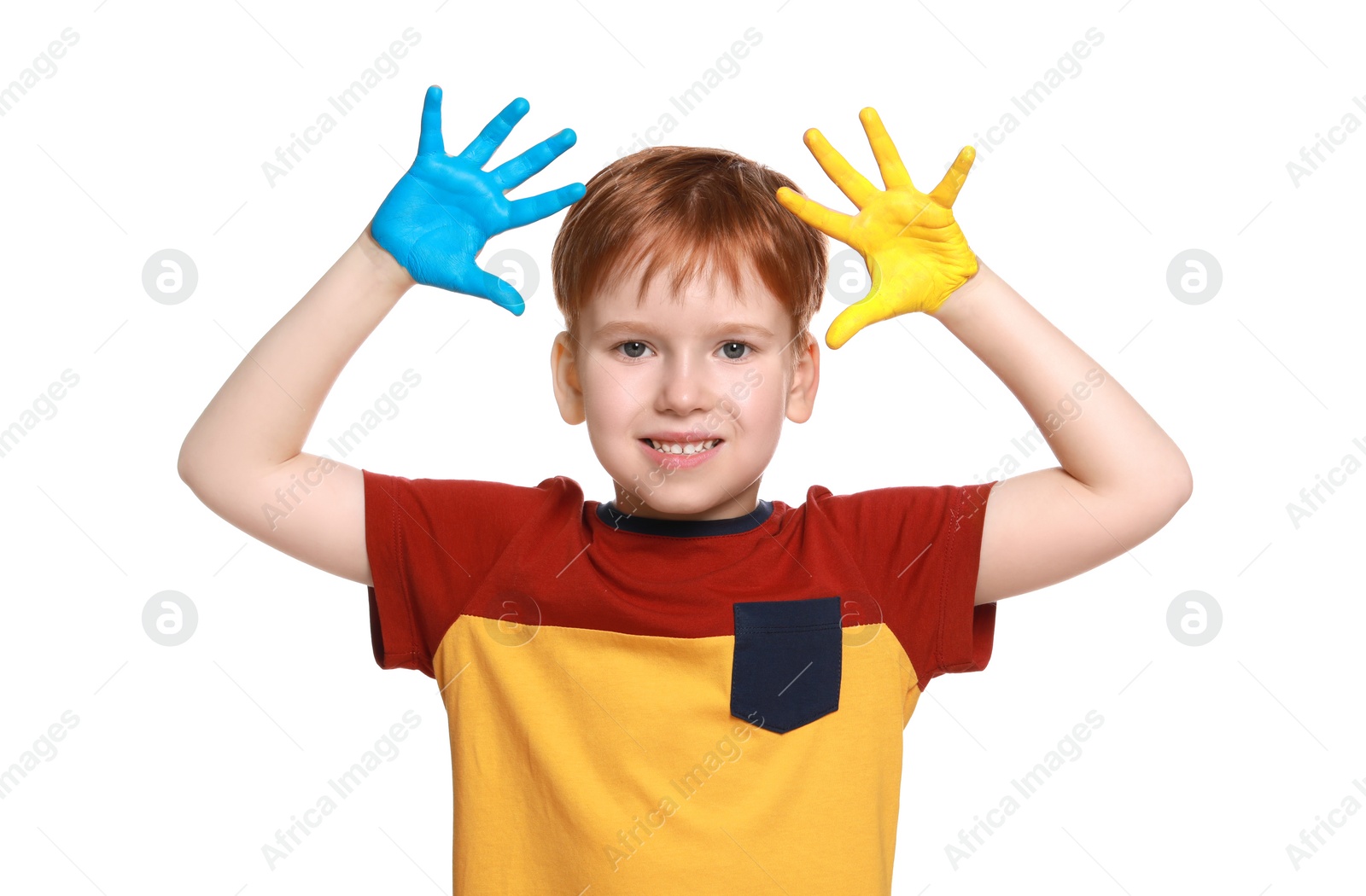 Photo of Little boy with hands painted in Ukrainian flag colors on white background. Love Ukraine concept