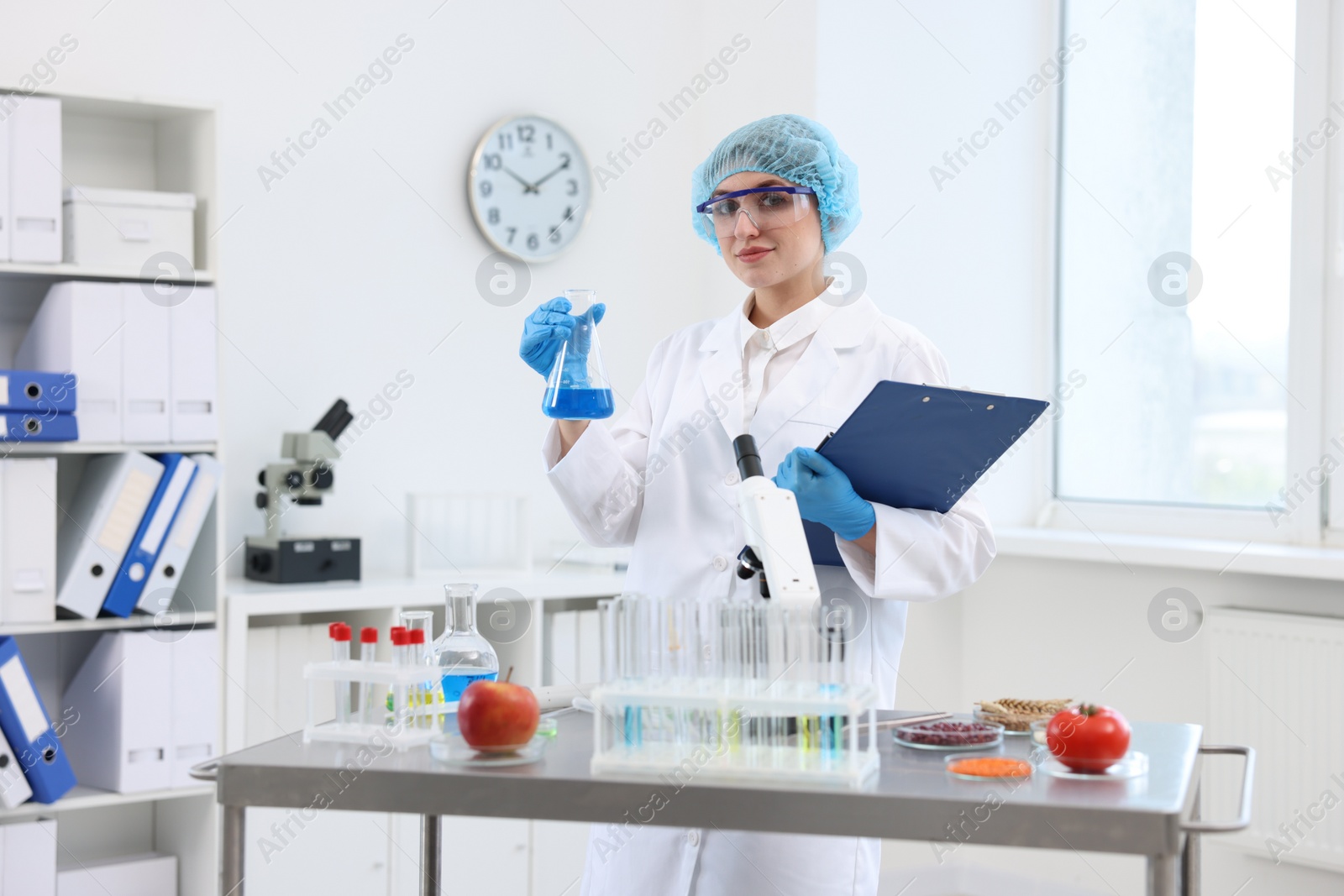 Photo of Quality control. Food inspector checking safety of products in laboratory