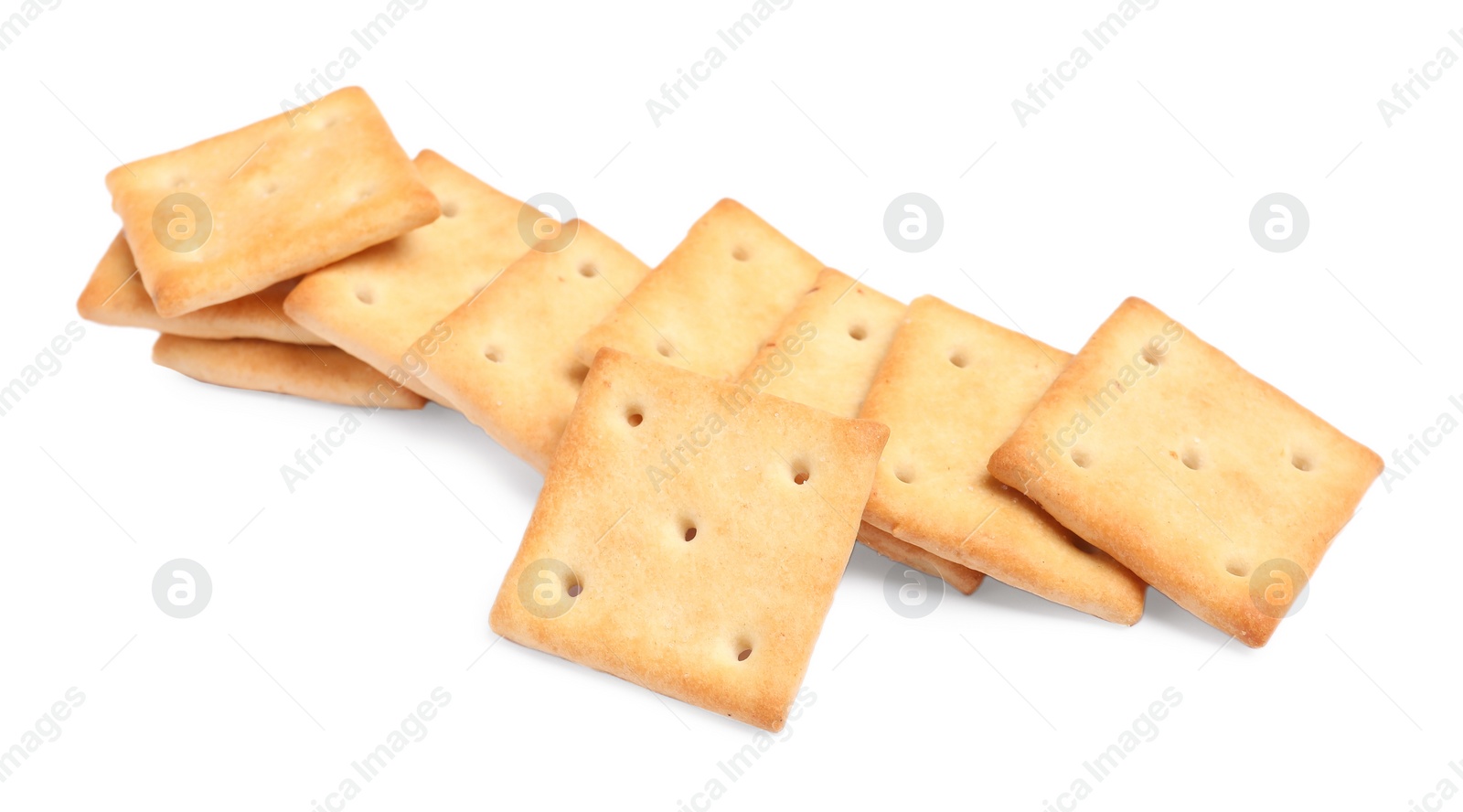 Photo of Tasty crispy square crackers isolated on white