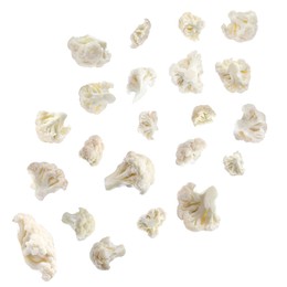 Many fresh cauliflower florets falling on white background