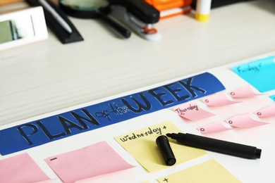 Photo of Business process planning and optimization. Workplace with colorful paper notes and other stationery on white wooden table