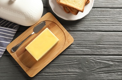 Photo of Flat lay composition with fresh butter and space for text on table