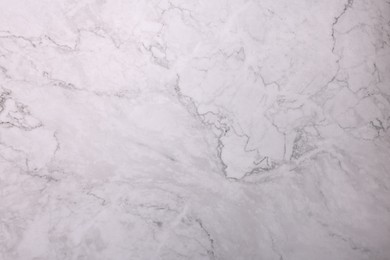 Photo of Texture of white marble surface as background, closeup