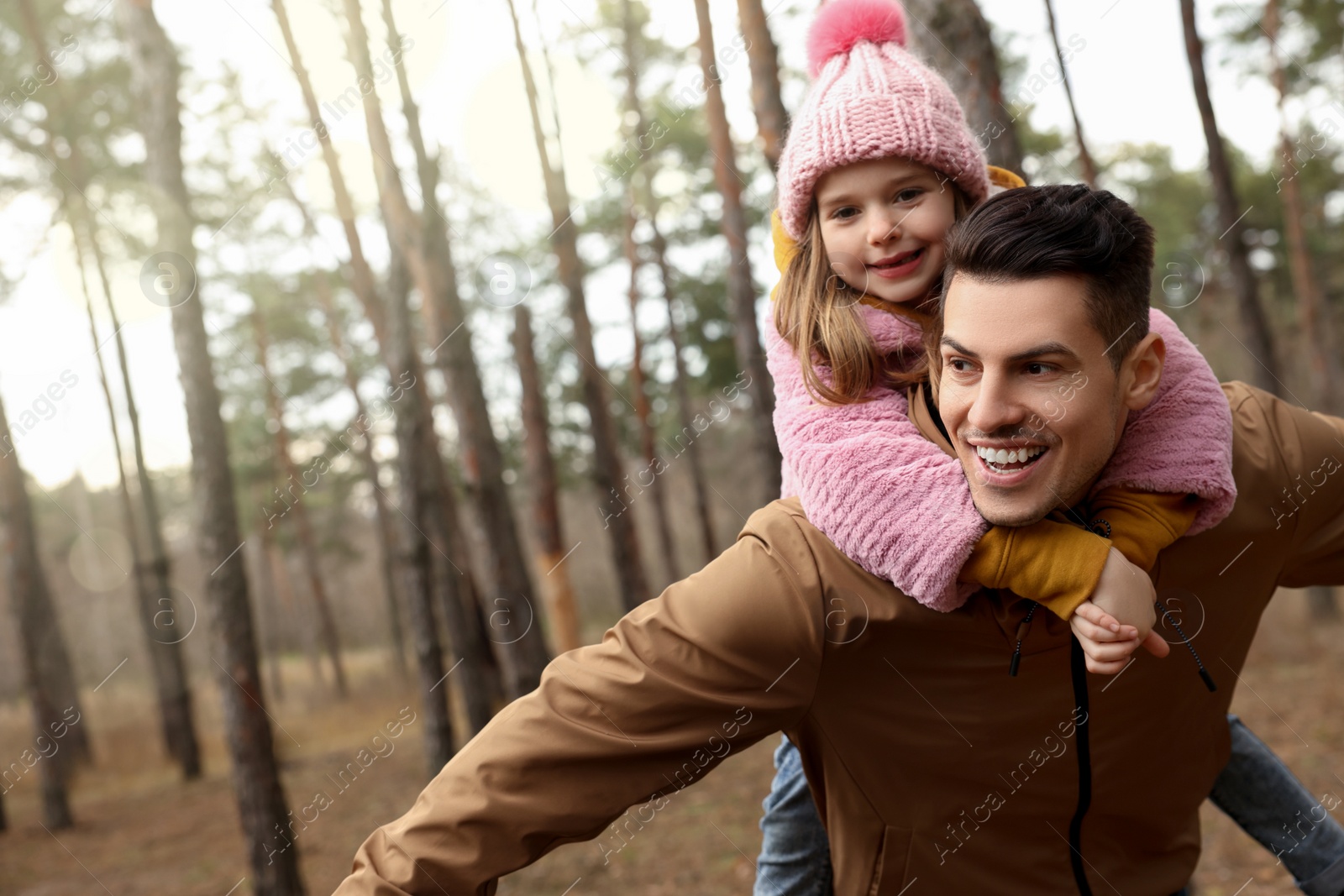 Photo of Man and his daughter spending time together in forest