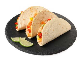 Photo of Delicious tacos with vegetables and slices of lime isolated on white