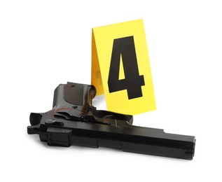 Photo of Gun and crime scene marker with number four isolated on white
