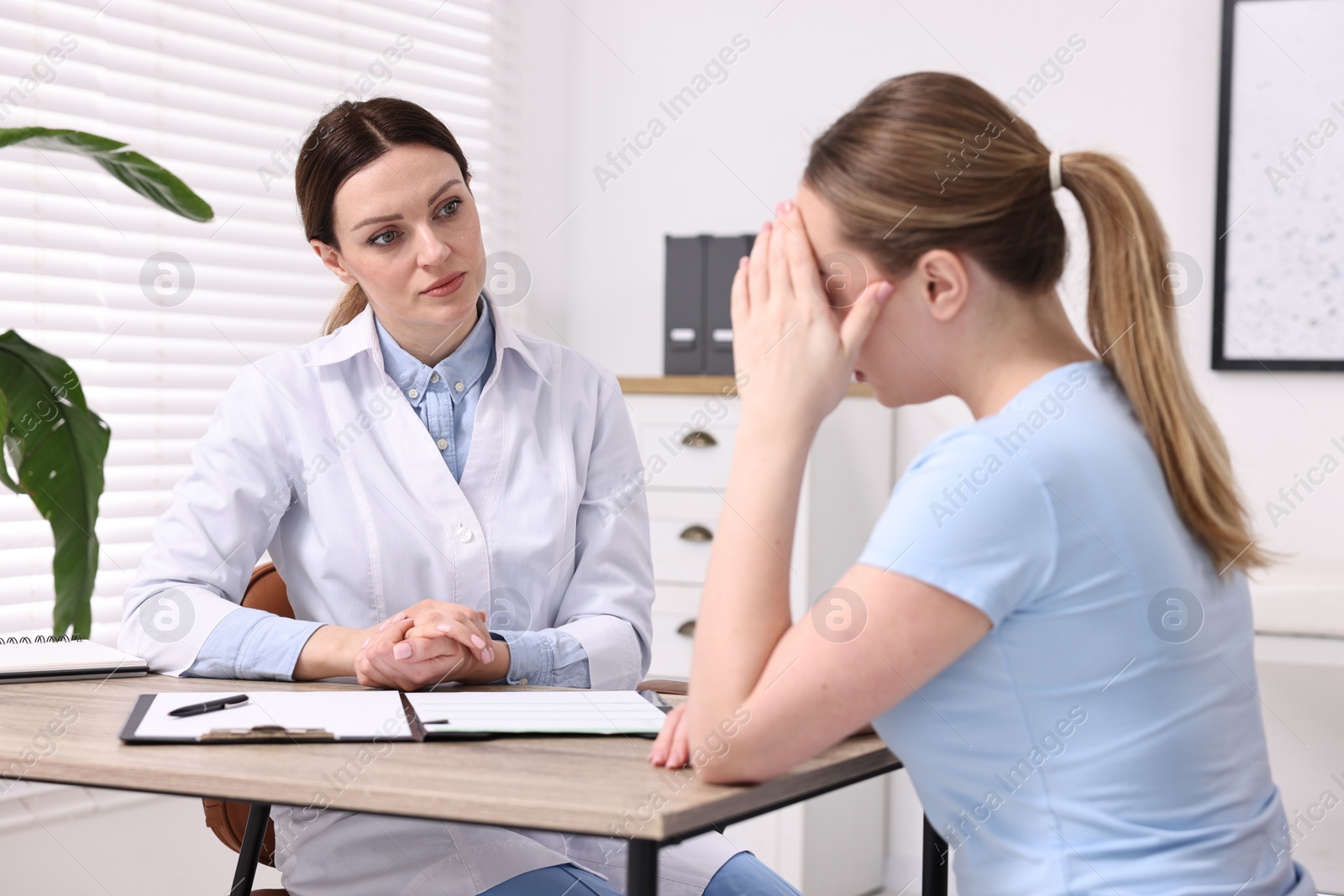 Photo of Mammologist's appointment. Doctor and woman in hospital