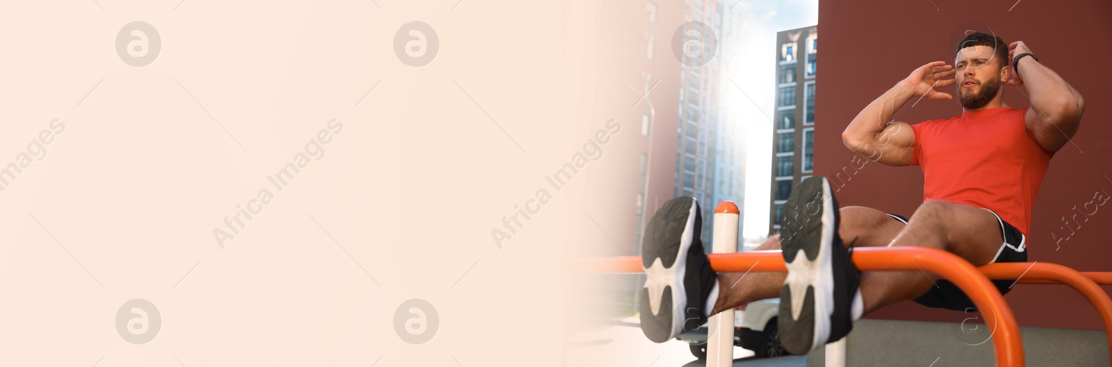 Image of Handsome man doing abs exercise on parallel bars at outdoor gym, space for text. Banner design