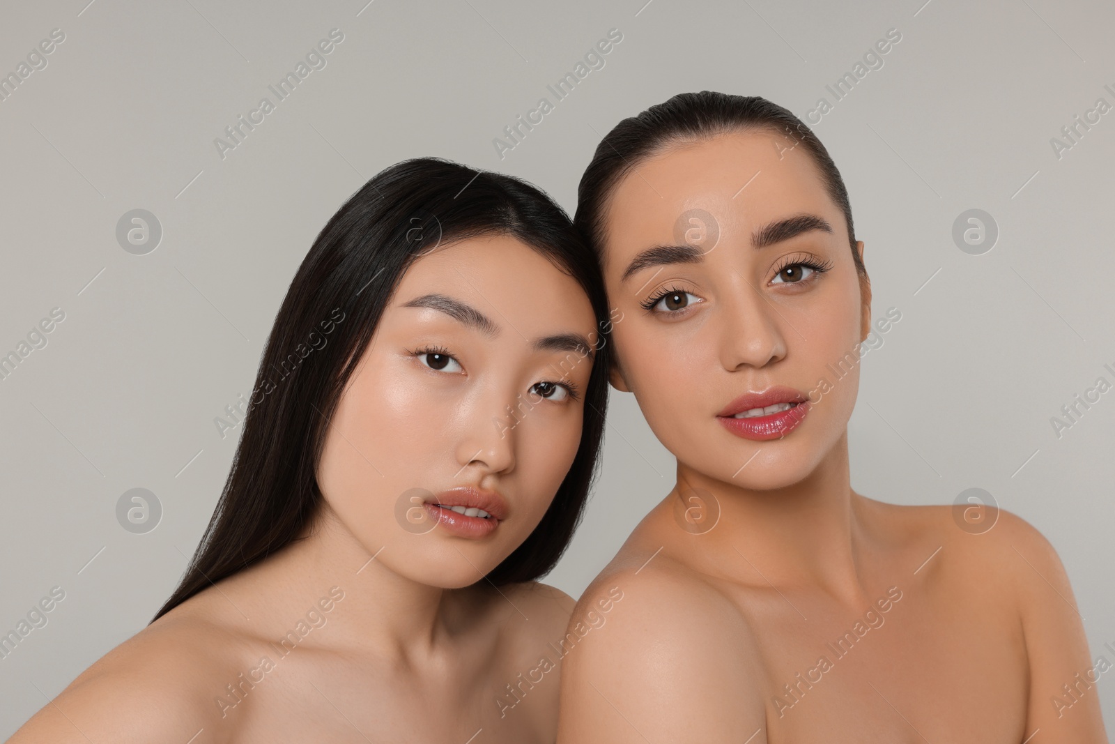 Photo of Portrait of beautiful young women on light grey background