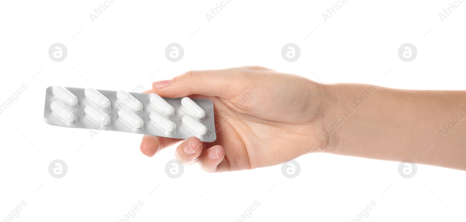 Photo of Woman holding pills in blister pack on white background, closeup