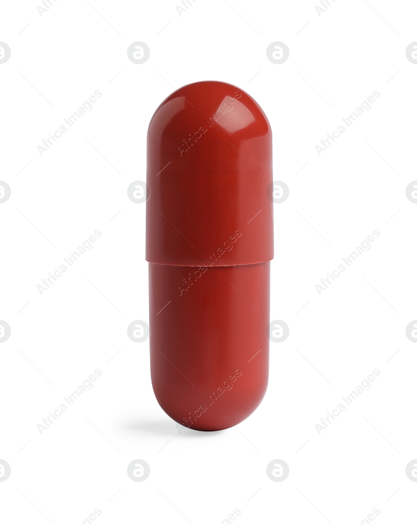 Photo of One red pill on white background. Medicinal treatment