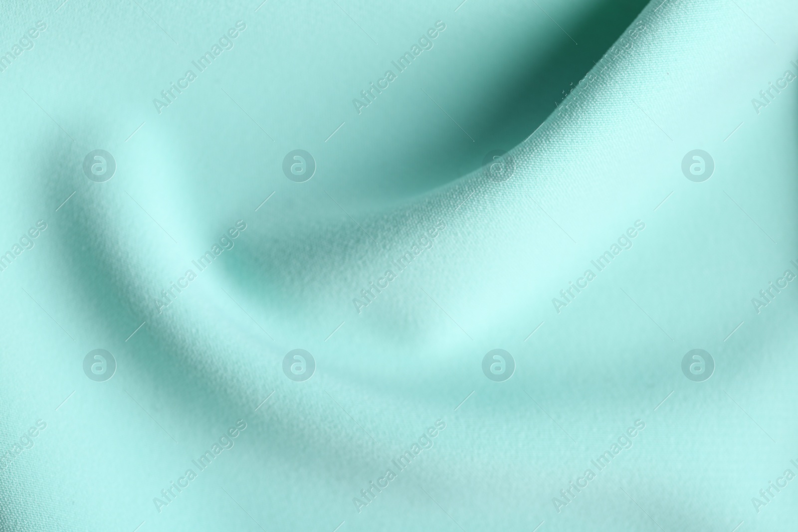 Photo of Texture of beautiful light blue fabric as background, closeup