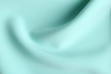 Texture of beautiful light blue fabric as background, closeup