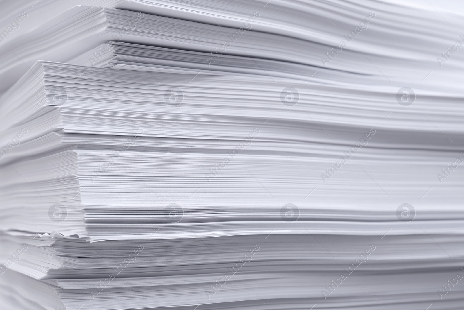 Photo of Stack of paper sheets as background, closeup