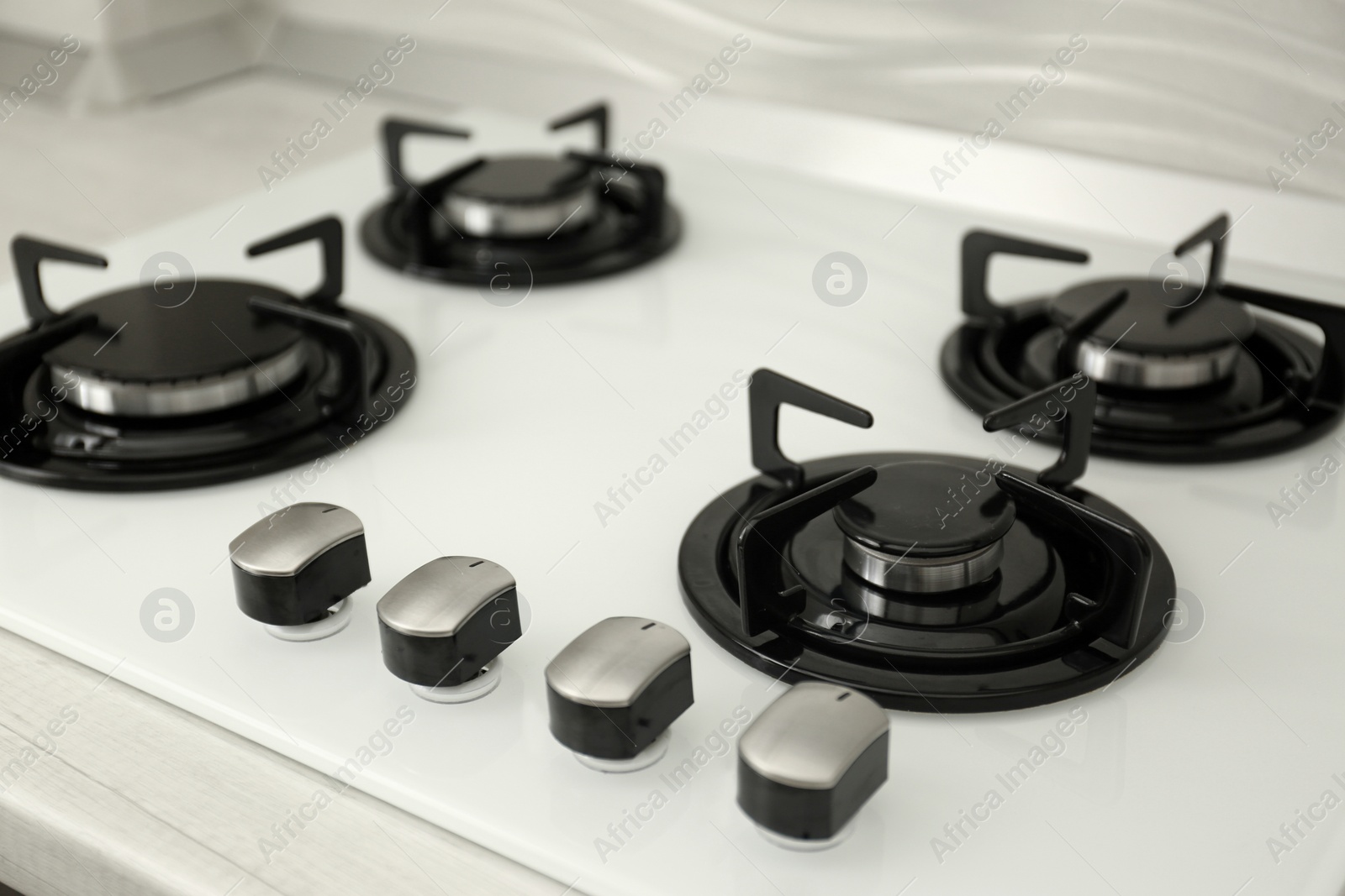 Photo of Modern built-in gas cooktop. Kitchen appliance