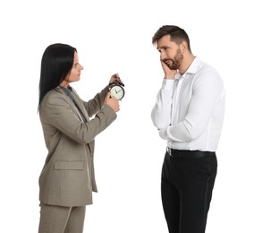Photo of Business woman with alarm clock scolding employee for being late on white background