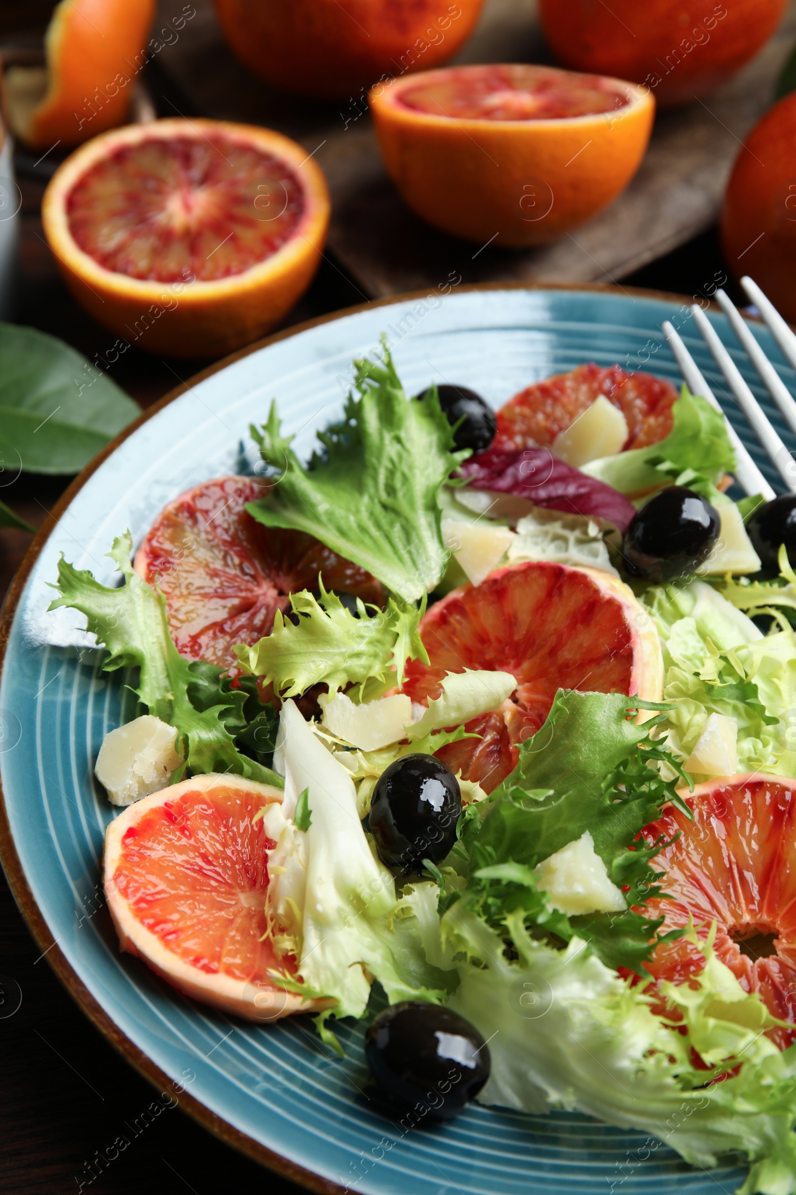 Photo of Plate of delicious sicilian orange salad on table, closeup