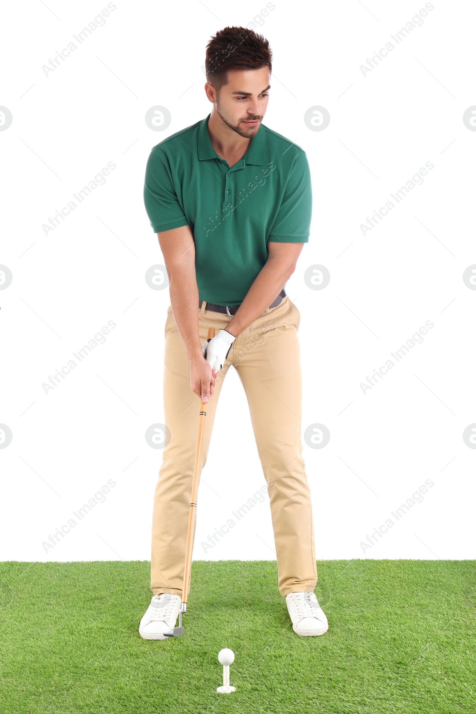 Photo of Young man playing golf on course against white background